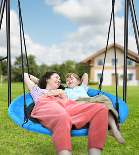 Trekassy saucer swing kids enjoy outdoor play under a blue sky