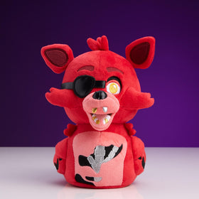 TUBBZ Foxy plush with weighted base standing upright on a desk