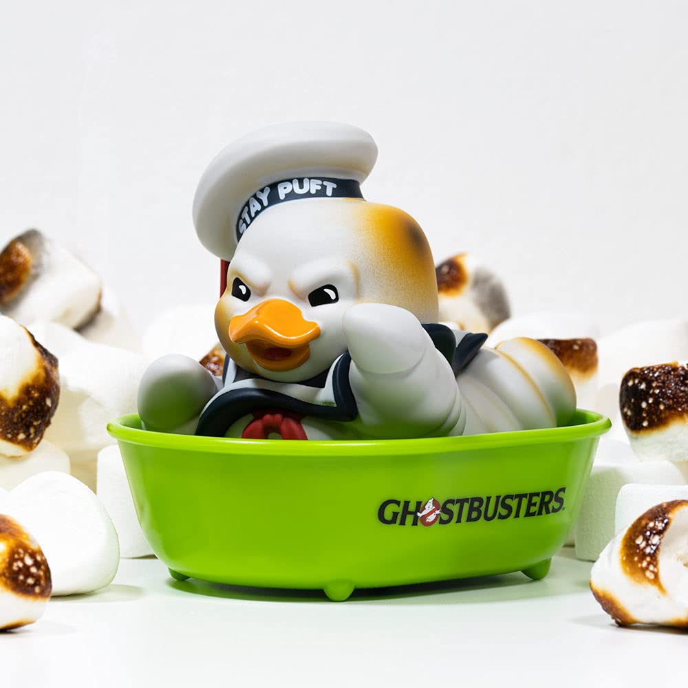 TUBBZ Stay Puft burnt duck on car dashboard, adds playful vehicle flair.
