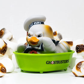 TUBBZ Stay Puft burnt duck on car dashboard, adds playful vehicle flair.