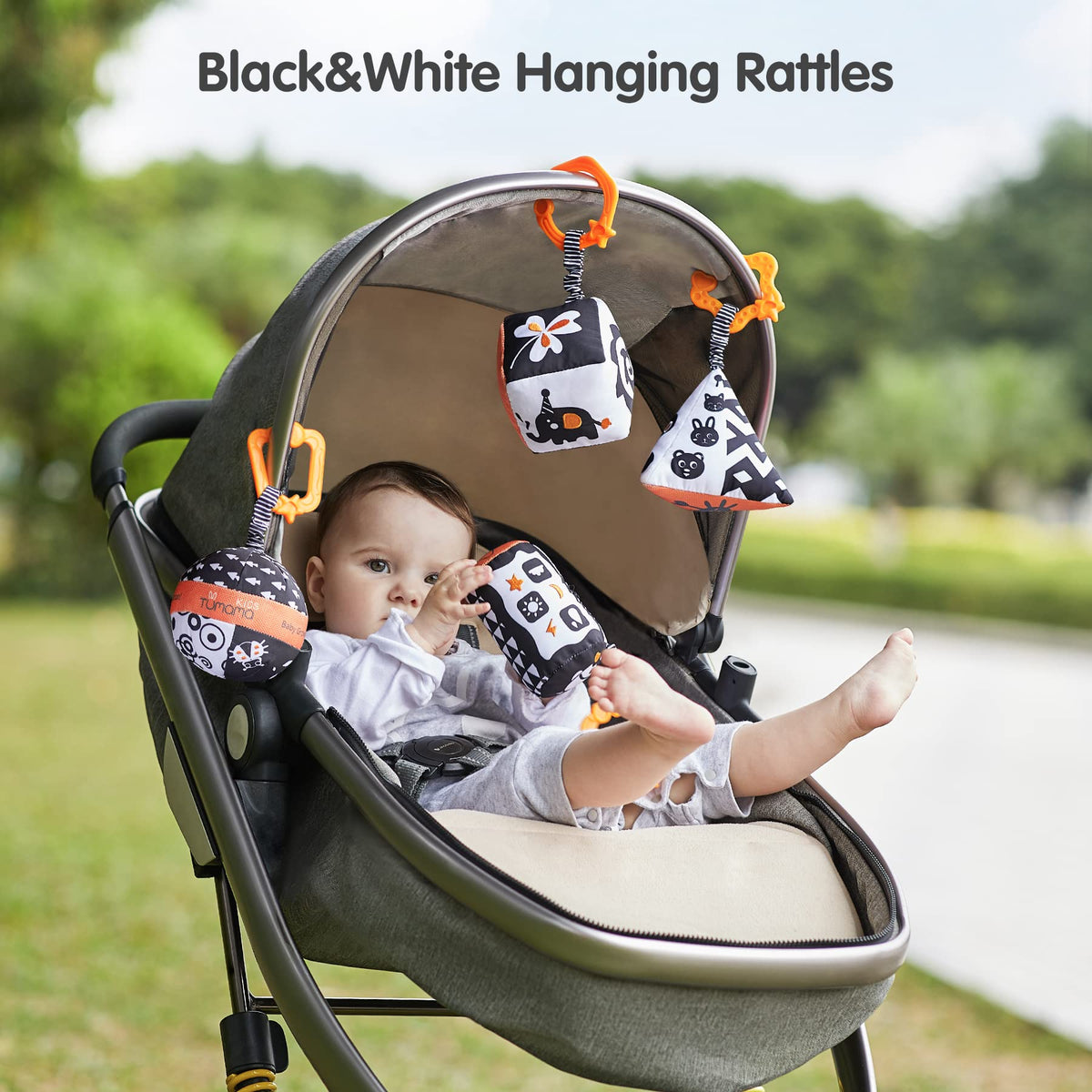 TUMAMA Black-and-white baby toy rattle encourages gaze tracking during play.
