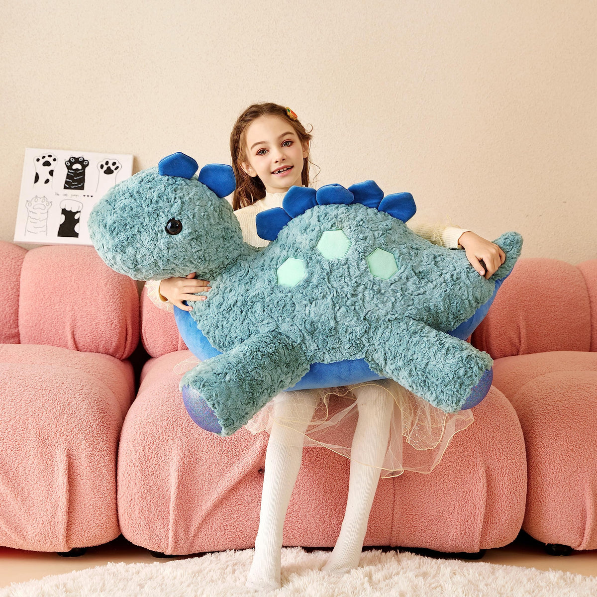 Tumyay Stegosaurus plush in cozy room decor setup.