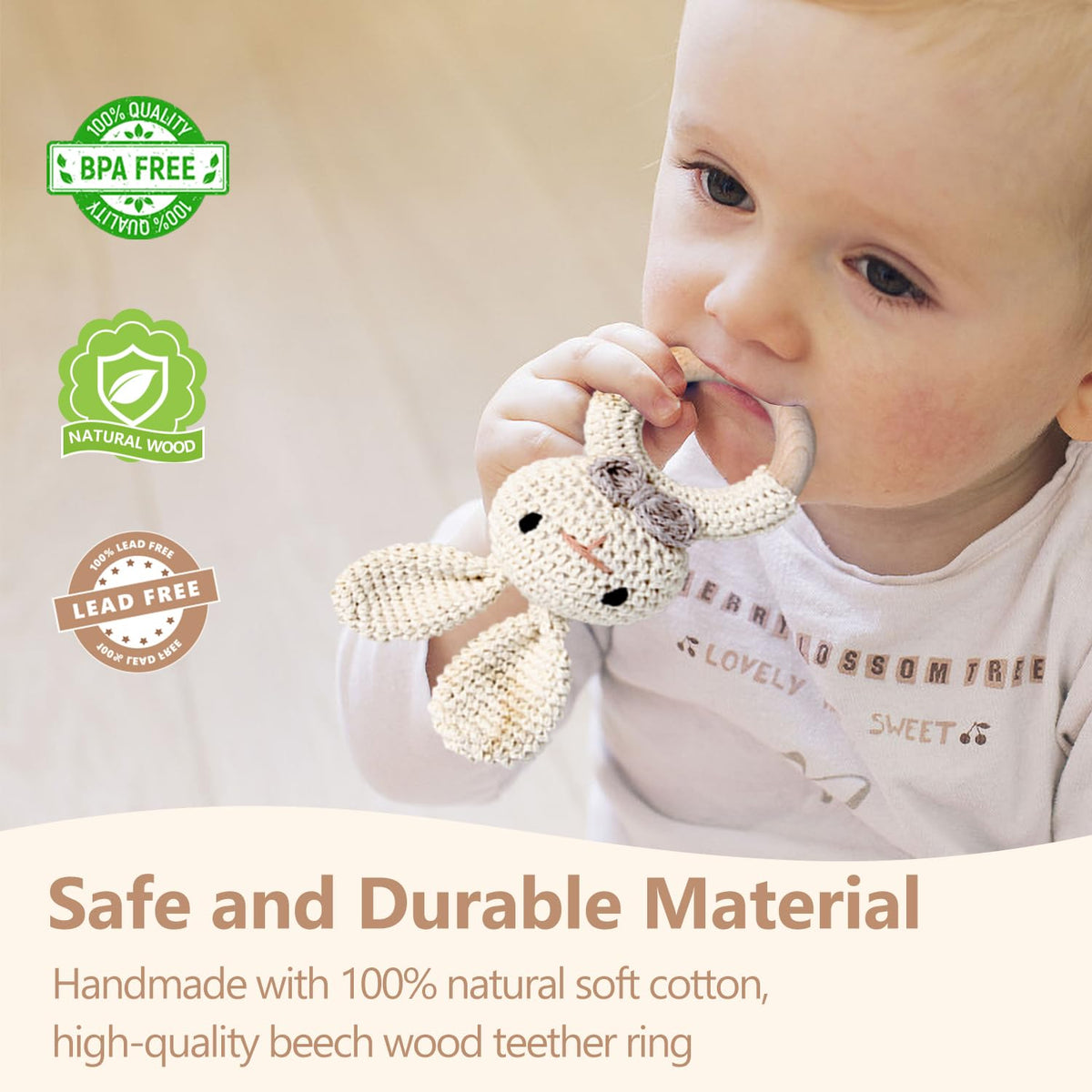 Tuowita newborn rattle with wooden teether ring shown in warm beige tones.