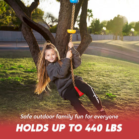 Kids enjoying a TURFEE swing in a sunny yard.