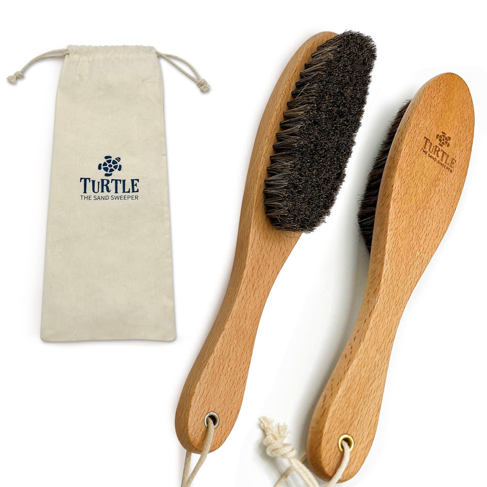 Turtle Sand Sweeper beach brush with soft bristles for gentle sand removal.