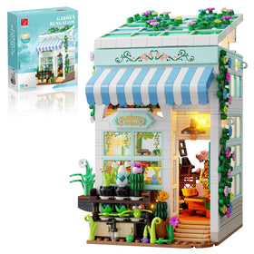 TYCOLE Flower House with LED lights illuminates a cozy desk decor scene.