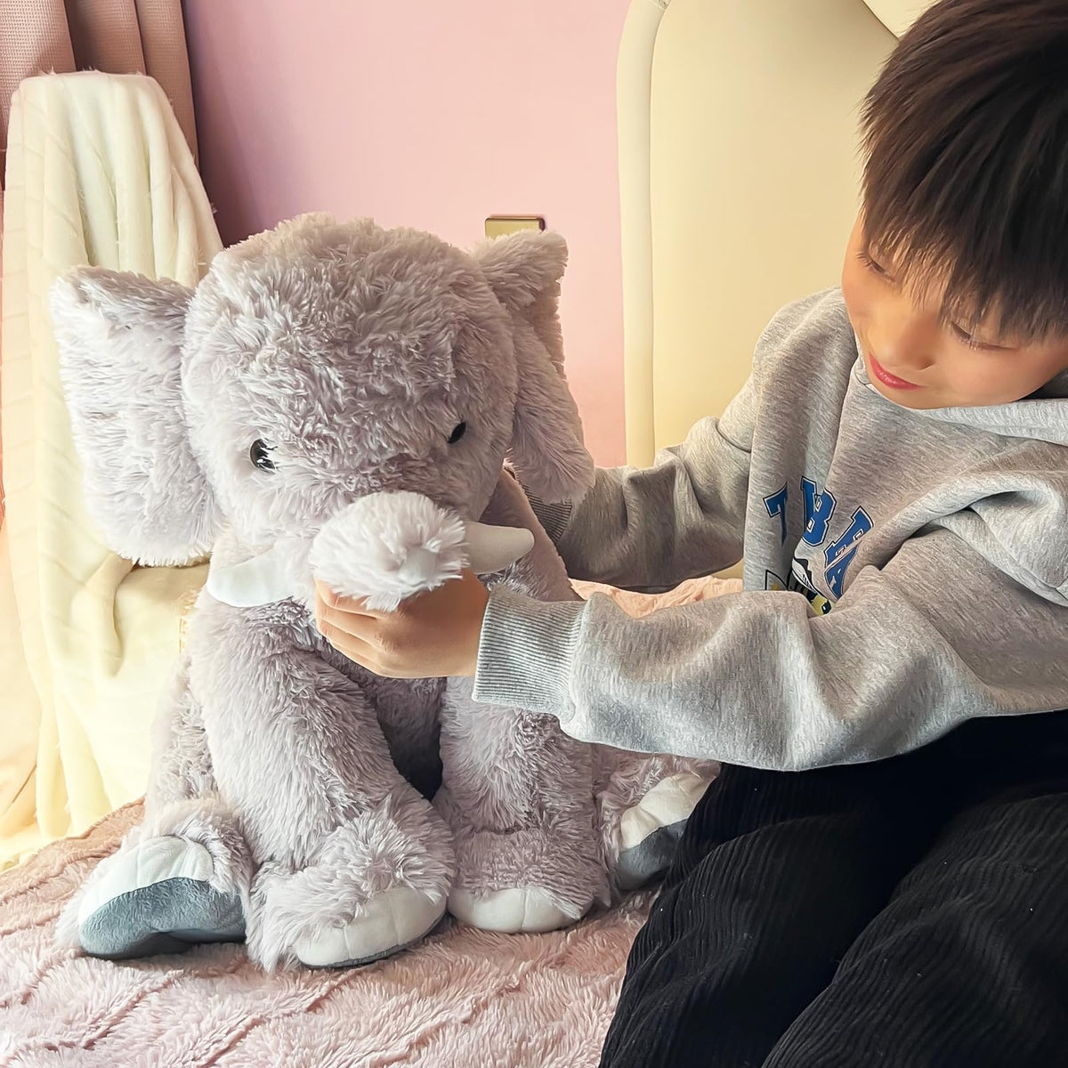 UBABER elephant plush used as a room decor accent in gray