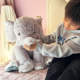 UBABER elephant plush used as a room decor accent in gray