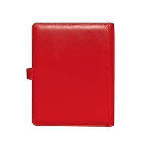 Close-up of enamel Poké Ball snap on red binder cover