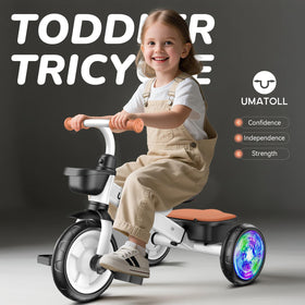 Umatoll tricycle with light-up wheels for added visibility during outdoor play.