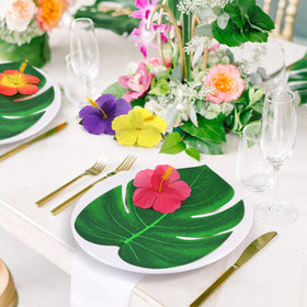 UMIKU table decor luau setup with palm leaves and hibiscus flowers