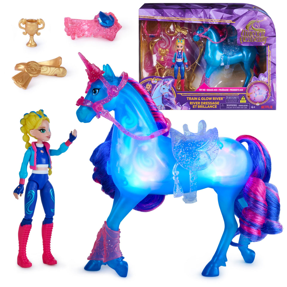 Unicorn Academy Train & Glow River doll set with Isabel guiding River through glow training.
