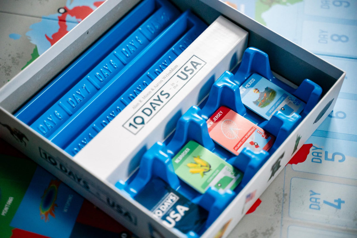 USAopoly 10 Days in the USA state cards spread across the board.