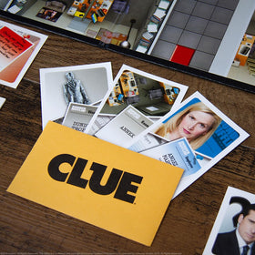 USAOPOLY CLUE Office Edition character movers in use during group play