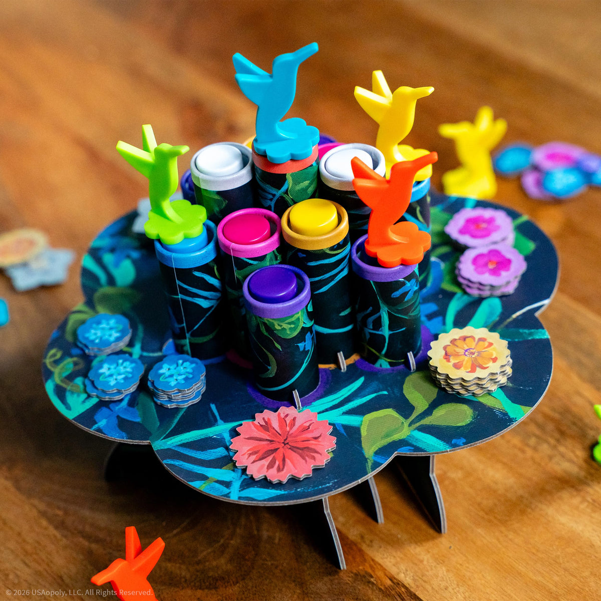 USAOPOLY Hummingbirds action tokens—risk-versus-reward choices boost replayability.