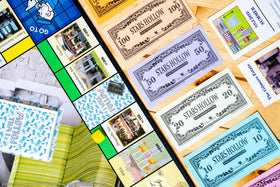 USAOPOLY Gilmore Girls School Newspaper token evokes Stars Hollow atmosphere during play.