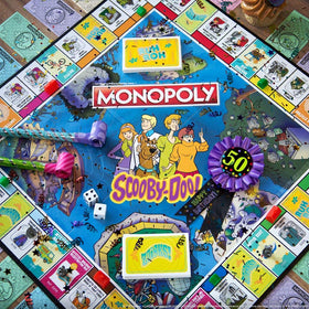 USAOPOLY Scooby-Doo location cards capture eerie spots for strategic trades.