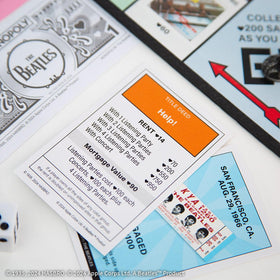USAOPOLY custom money reflecting the Beatle era in play.