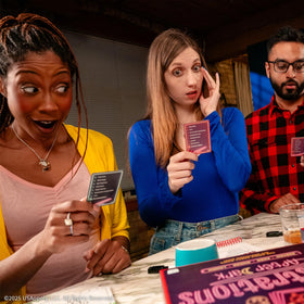 USAOPOLY Telestrations After Dark naughty prompts card adds risqué humor to nights.