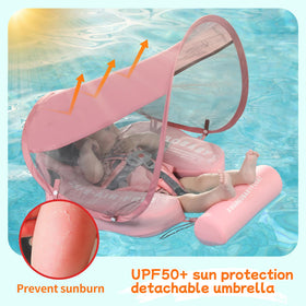 Baby enjoying Mambobaby float in pool surroundings