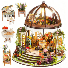 Vaki Vaki hanging garden miniature house with warm LED glow enhances shelf display.