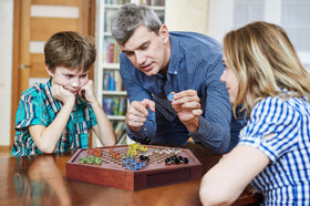 VAMSLOVE Chinese Checkers set pictured as a gift and home centerpiece option.