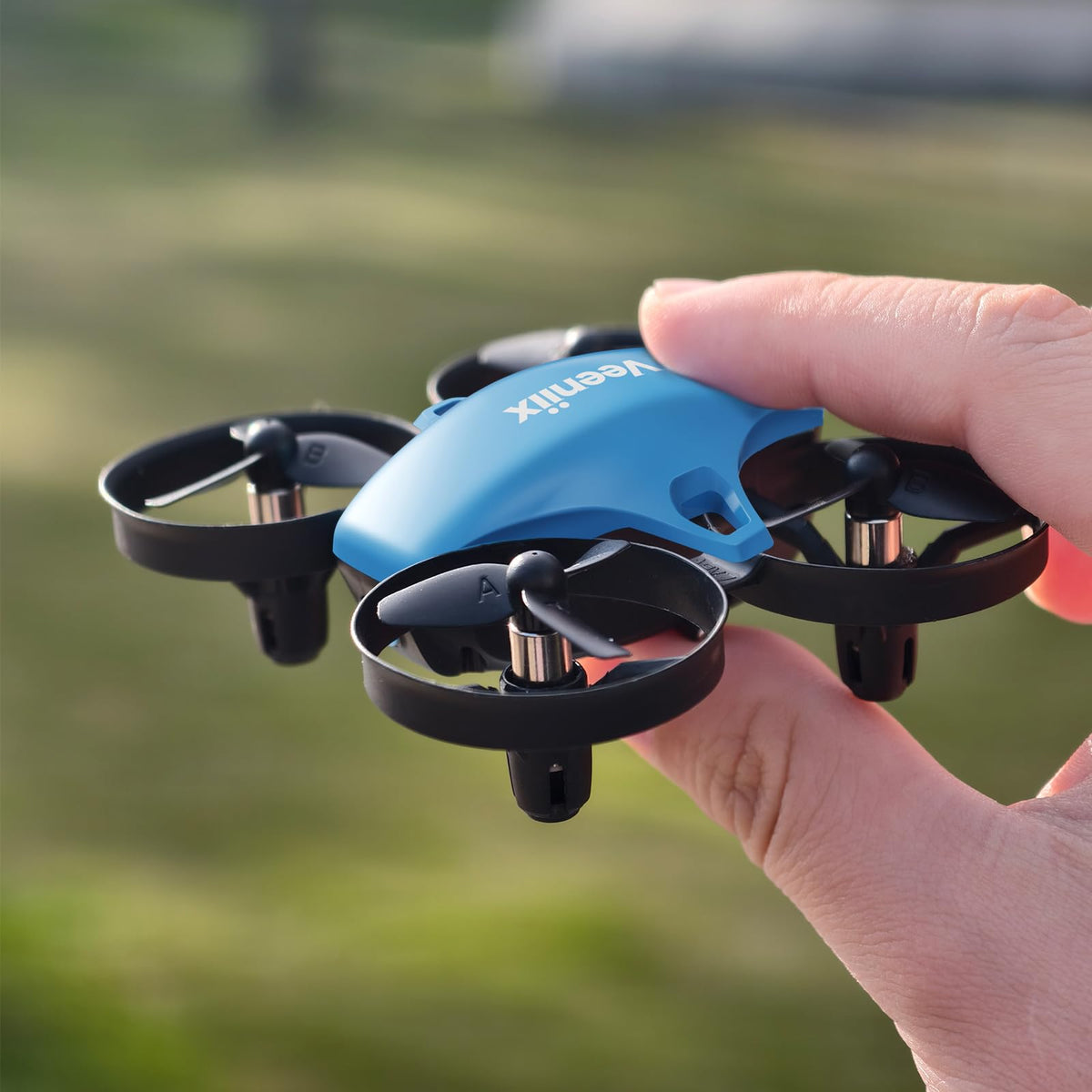 Veeniix V995 mini drone performing vibrant flips for kids and beginners.