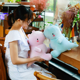 VHYHCY plush dinosaur pillow form ideal for naps and reading.