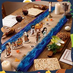 Vicenpal Passover set Moses figure highlights Exodus-inspired table accents.