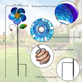 Viveta wind spinner close-up on blue petals with crystal bead, decorative focal point
