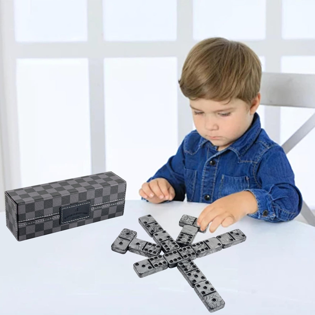 Vovotuzzi luxury black dominoes set designed for travel.