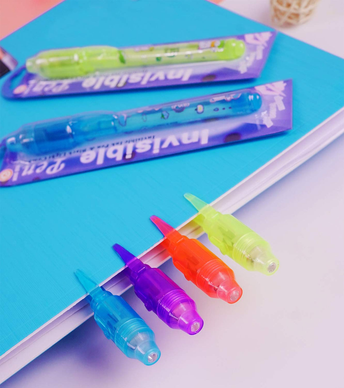 Close-up of writing invisible message with VOVRU pen under UV light.