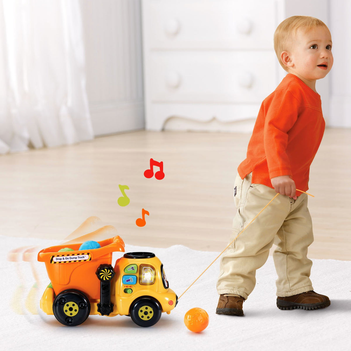 VTech Drop and Go Dump Truck orange playtime; durable plastic supports everyday exploration