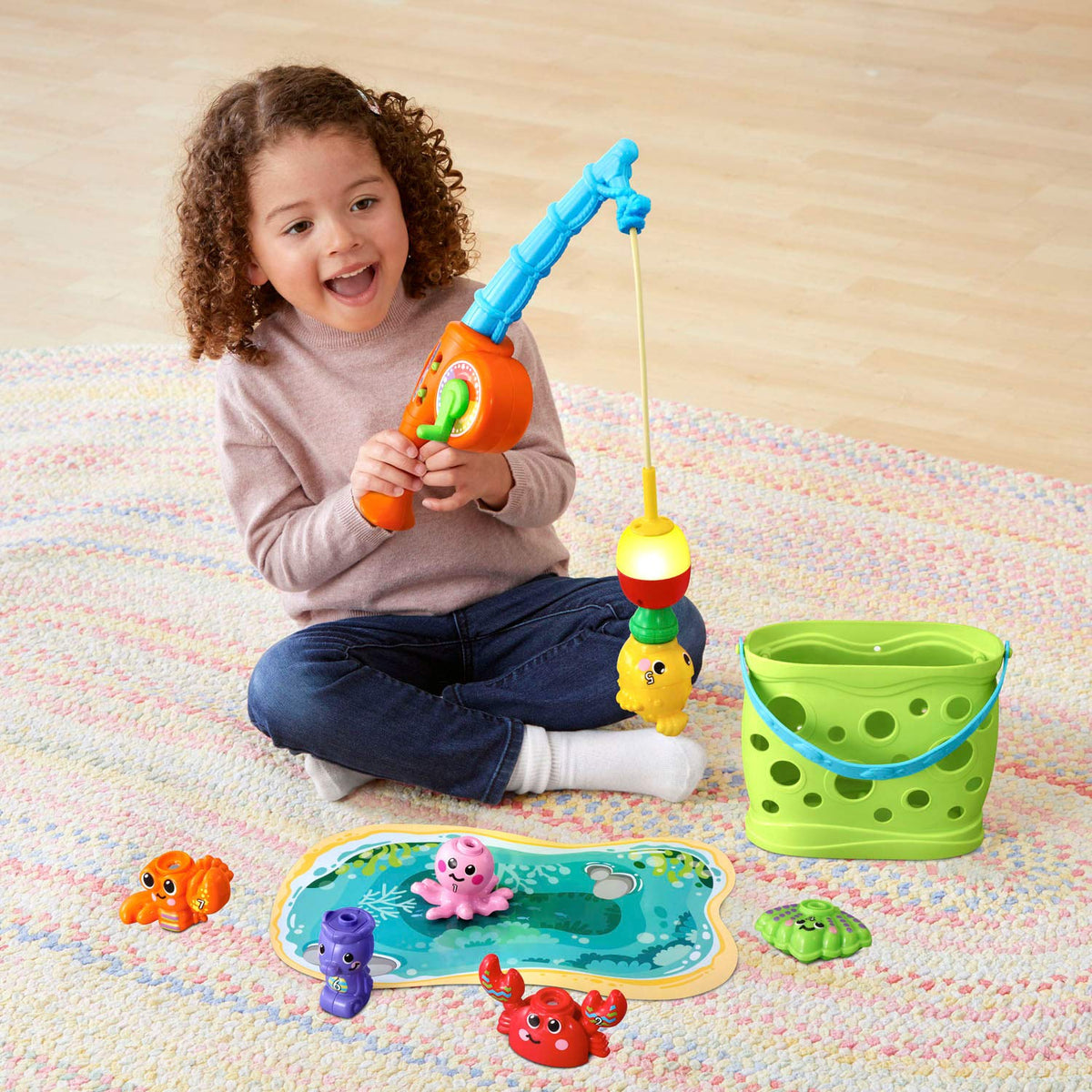 Magnetic catch teaches hand-eye coordination during pretend fishing with VTech set