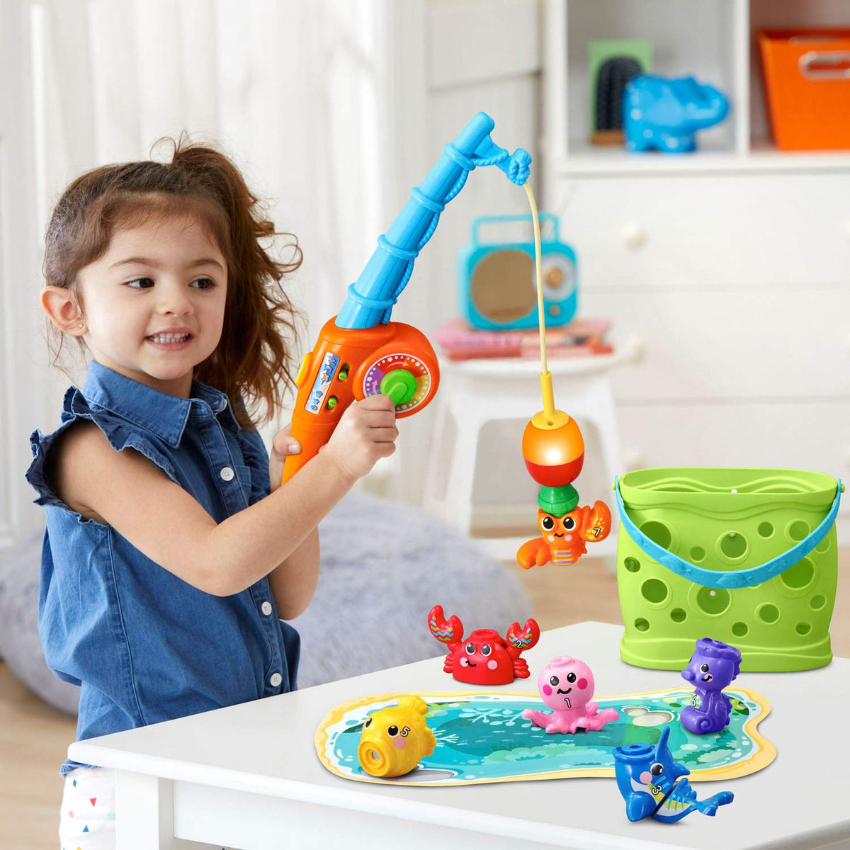 Pond playmat storage area in the Jiggle and Giggle Fishing Set bucket