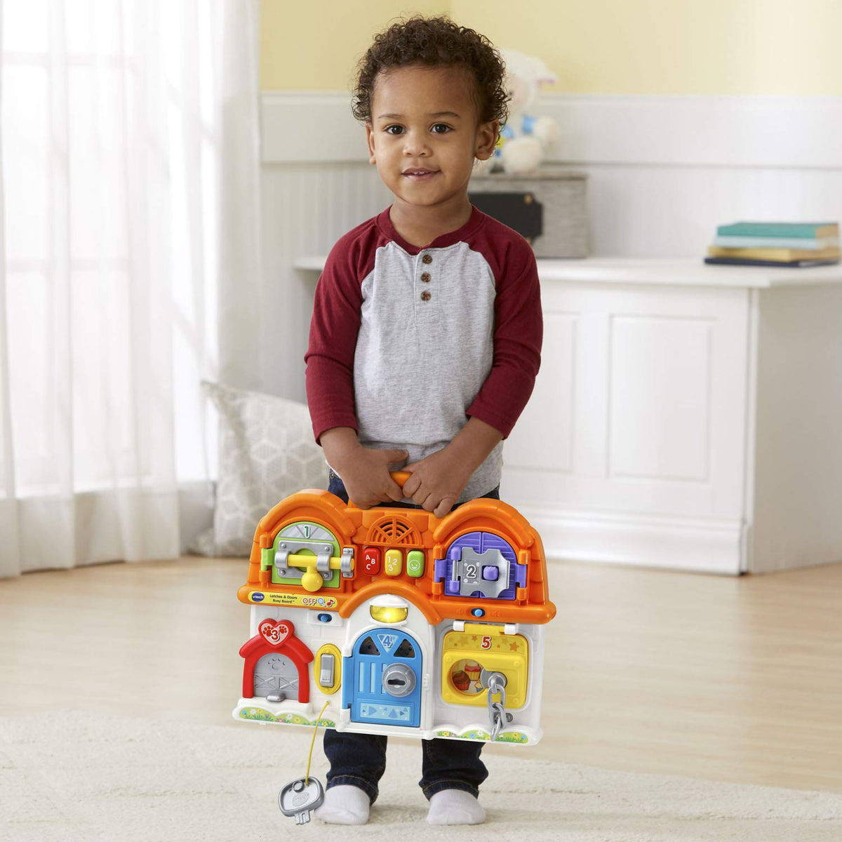 VTech Latches and Doors Busy Board adorable family graphics encourage pretend play
