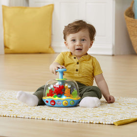 VTech Learn and Spin Aquarium: plunger press triggers sounds and tunes.