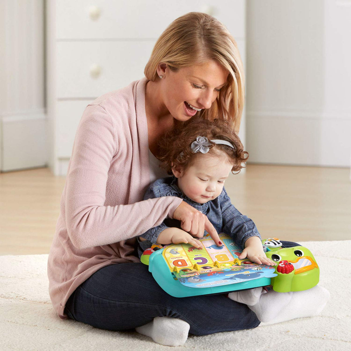 VTech starfish buttons light up to reward learning.
