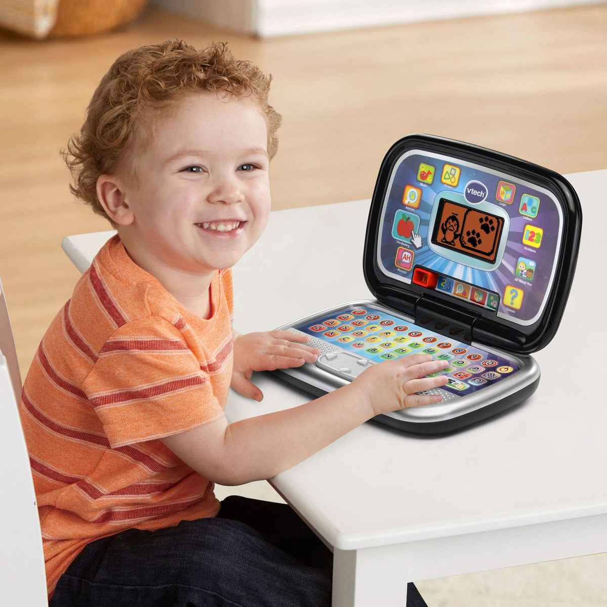 Screen interface of the VTech Play Smart Preschool Laptop with colorful activities