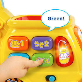 VTech Pop-a-Balls Bulldozer button area teaches colors, numbers, and tunes during curiosity-driven play.