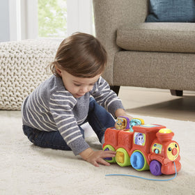 VTech Pop and Sing Animal Train push-along play supports sound and melodies
