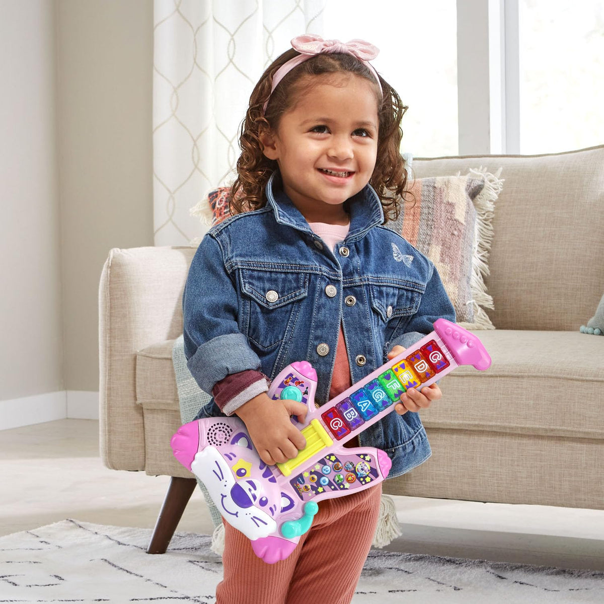 VTech Zoo Jamz Tiger Rock Guitar acoustic and electric knobs highlight sound style options for kids.