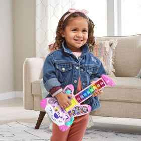 VTech Zoo Jamz Tiger Rock Guitar acoustic and electric knobs highlight sound style options for kids.