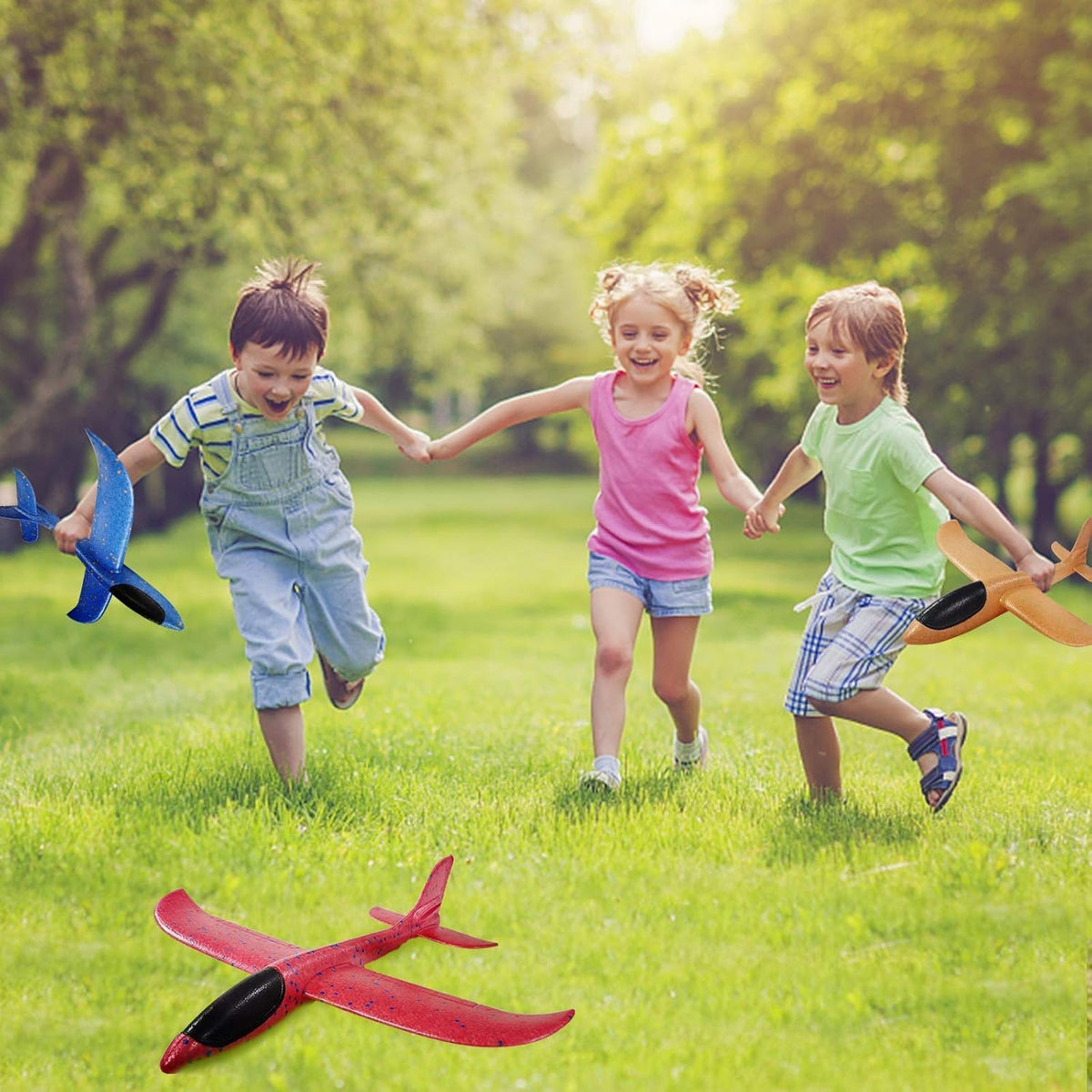 Vyndicca foam airplane used outdoors with family at a park or beach.