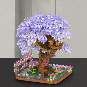 Vziimo Cherry Blossom Bonsai Tree assembly in progress capturing hands-on focus.