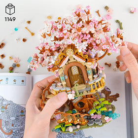 Vziimo Cherry Blossom Treehouse swing and pond add interactive charm