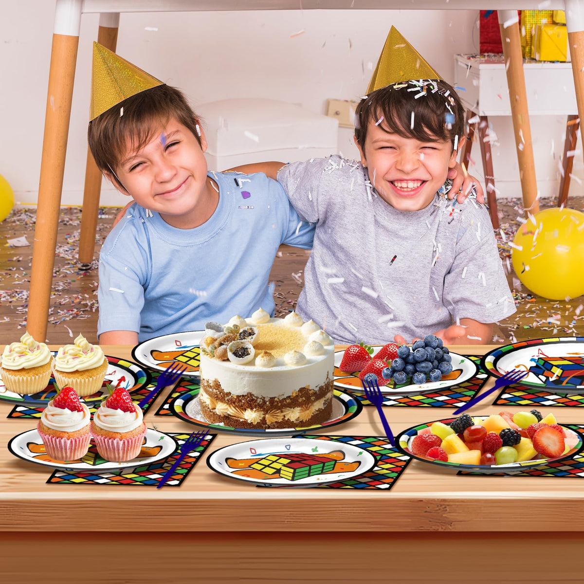 WAHA-GG video game party backdrop complements colorful cube tableware for a cohesive look.