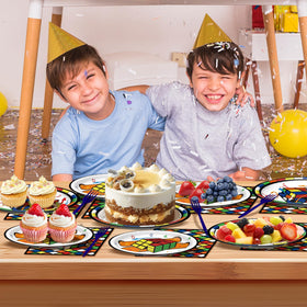 WAHA-GG video game party backdrop complements colorful cube tableware for a cohesive look.