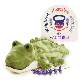 Warmies Alligator plush being heated for cozy nighttime warmth.