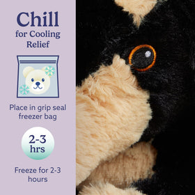 Child cuddling Warmies dachshund plush at bedtime for comfort and routine.